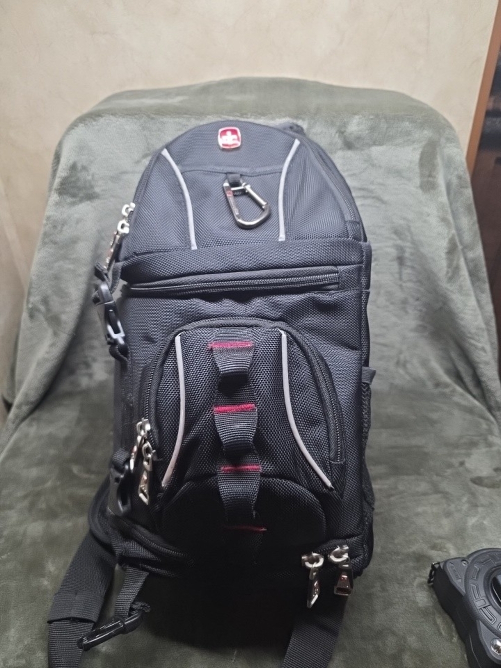 SwissGear Black Sling Camera Bag with Red Accents